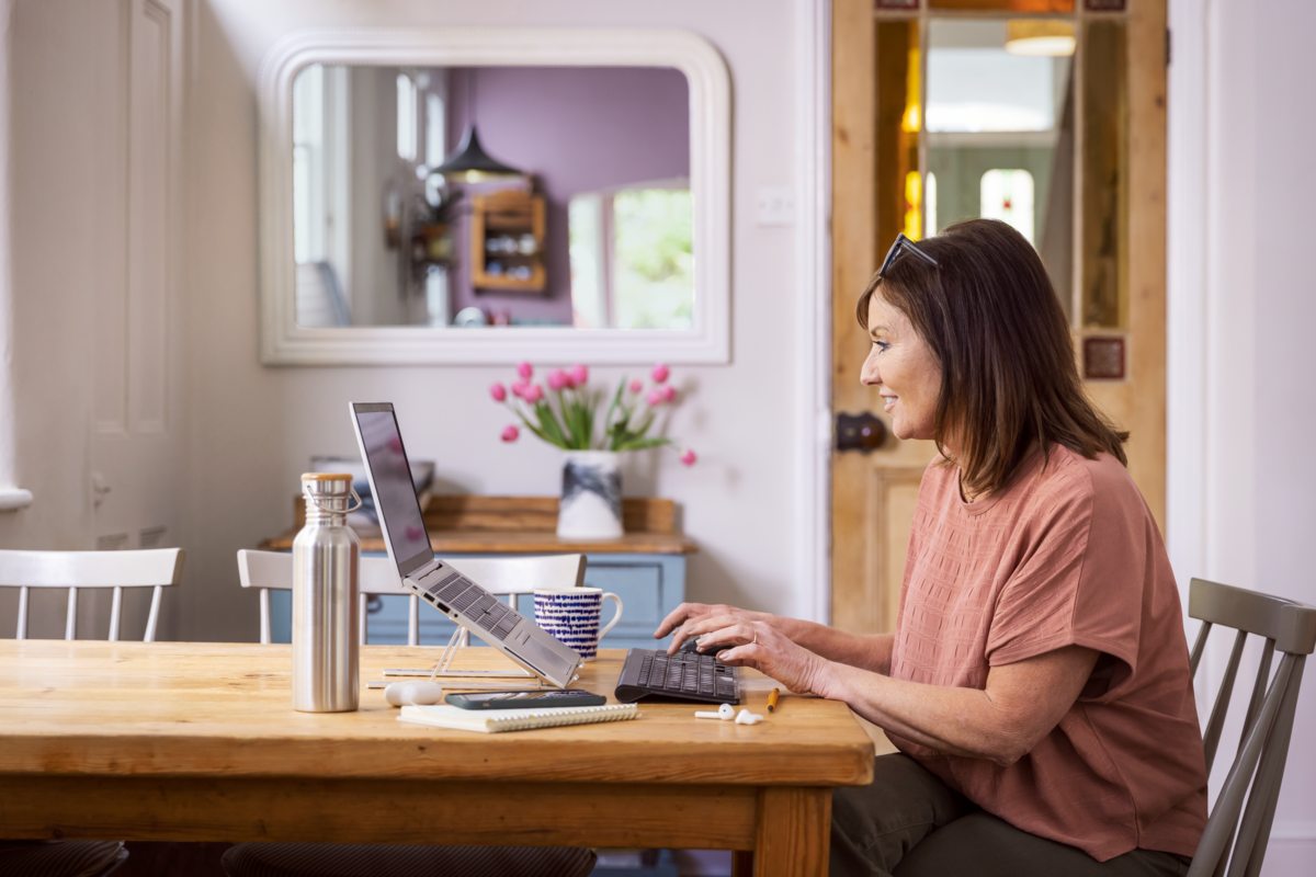 severe asthma patient sitting on couch with tablet